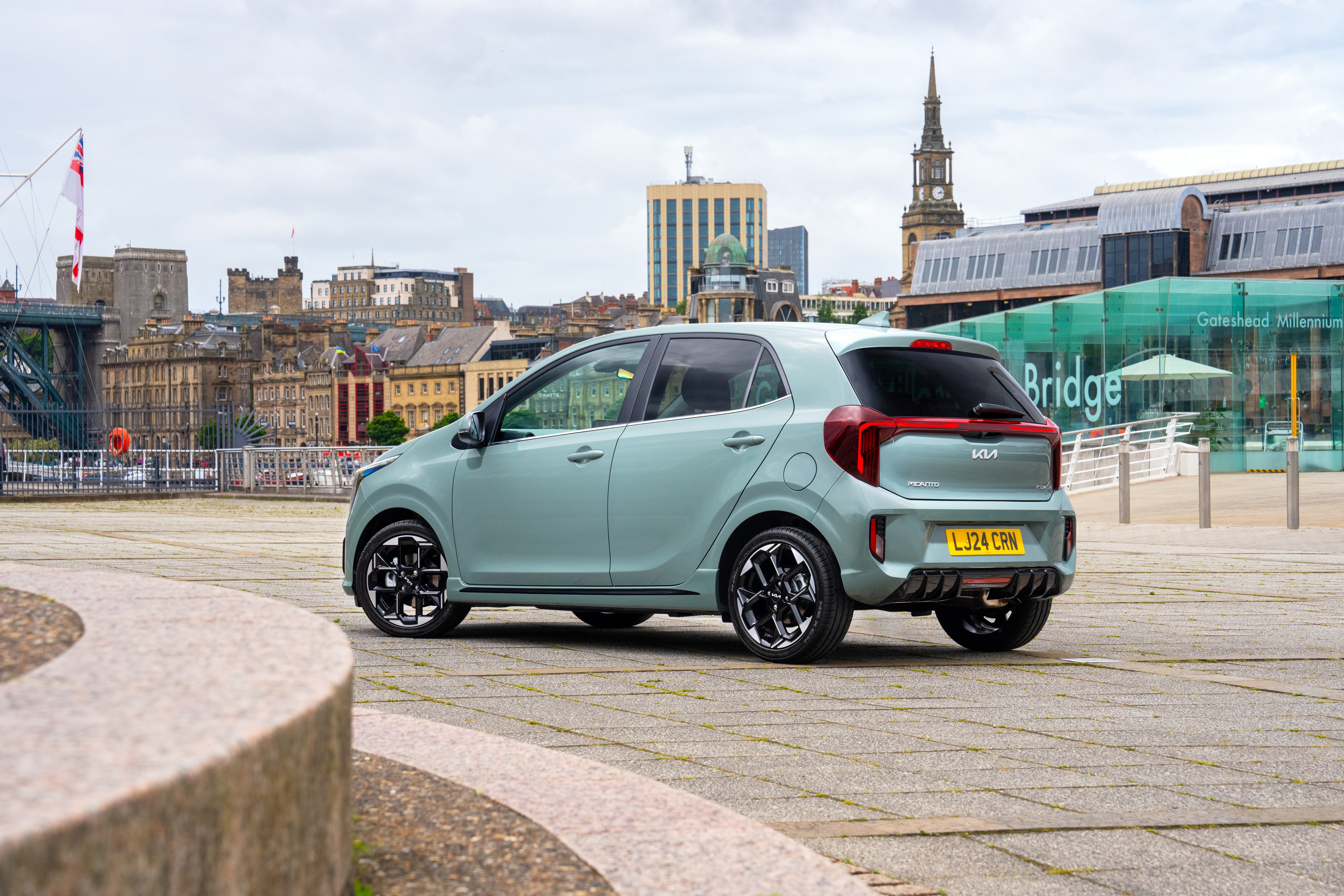 Kia Picanto rear three quarters in a city